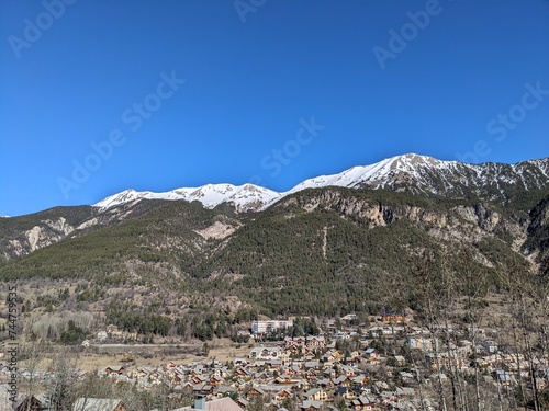 Alps winter snow topped mountains valley town © Brent
