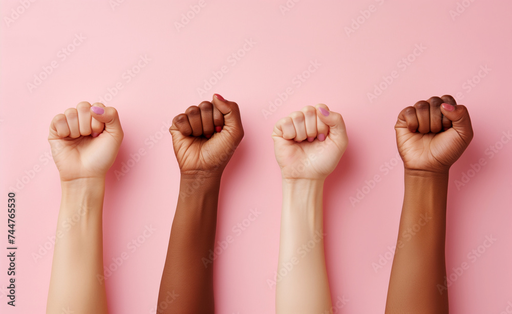 Unity in Diversity: Women's Fists on Pink Background Unity in Diversity: Women's Fists on Pink Background