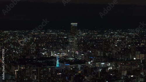 Wallpaper Mural Aerial panoramic view of metropolis at night. Tall modern skyscraper towering above surrounding town development. Osaka, Japan Torontodigital.ca