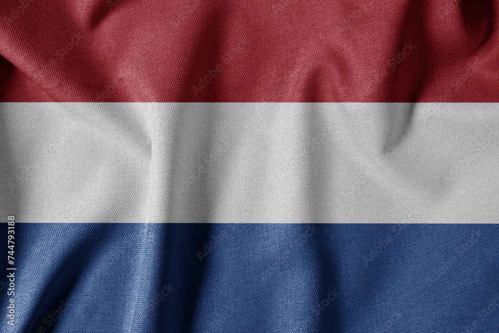 National Flag on Textured Fabric Background. Silk textured flag, realistic wave and flag look. NL  Flag of The Netherlands