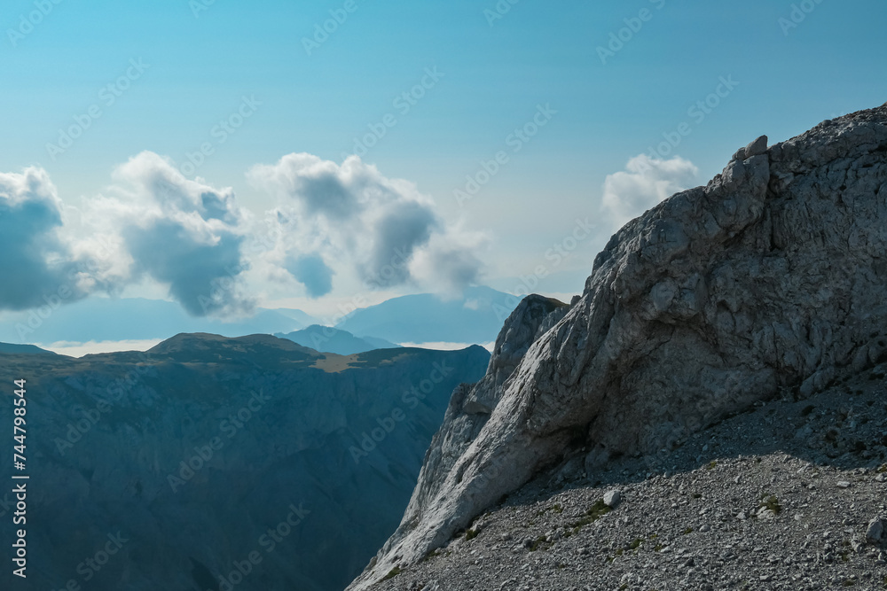 Panoramic view of majestic mountain peaks of Hochschwab massif, Styria, Austria. Idyllic hiking trail on high altitude alpine terrain, remote Austrian Alps in summer. Sense of escape. Nature lover