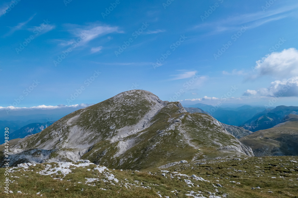 Panoramic view of majestic mountain peak of Hochschwab massif, Styria, Austria. Idyllic hiking trail on high altitude alpine meadow, remote Austrian Alps in summer. Seen from top of mount Zagelkogel