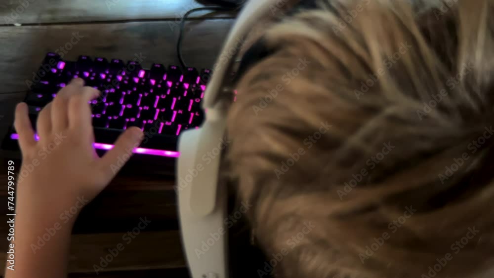 Boy playing game on computer using keyboard and mouse Stock Video ...