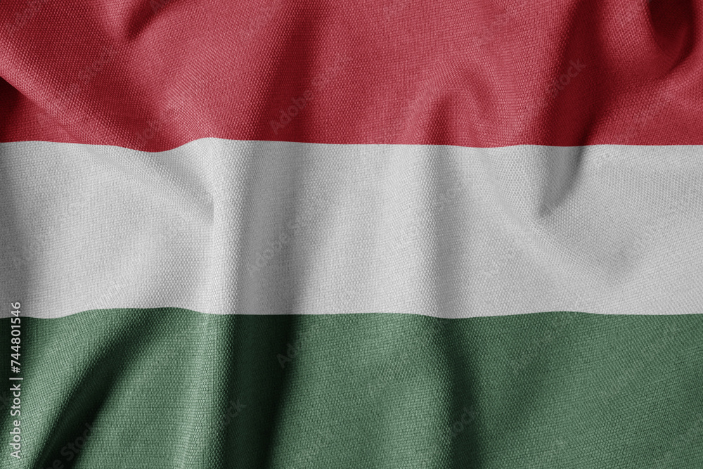 Obraz premium National Flag on Textured Fabric Background. Silk textured flag, realistic wave and flag look. HU Flag of Hungary