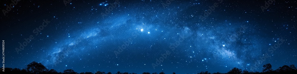 Ethereal blue night sky with a scattered star field, capturing the tranquil beauty of the cosmos Ethereal blue night sky with a scattered star field, capturing the tranquil beauty of the cosmos