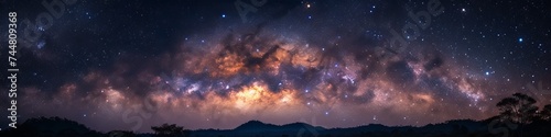 Galactic dreamscape with vibrant Milky Way clouds illuminating the night sky above a darkened landscape