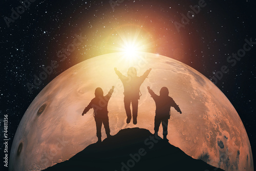 Silhouette of three astronauts against the background of Mars. Elements of this image courtesy of NASA
