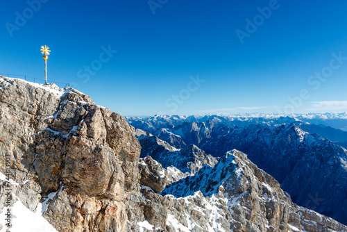 Golden cross on the German side of the Mount Zugspitze in Germany, Europe © jeeweevh