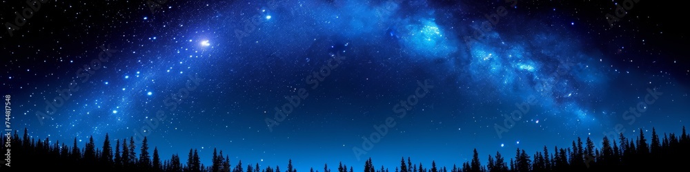 Expansive night sky panorama featuring a vivid blue nebula stretching across the starry expanse above a forested horizon