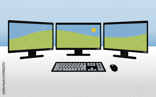 set of three computer monitors with panorama in background, photography editing workspace