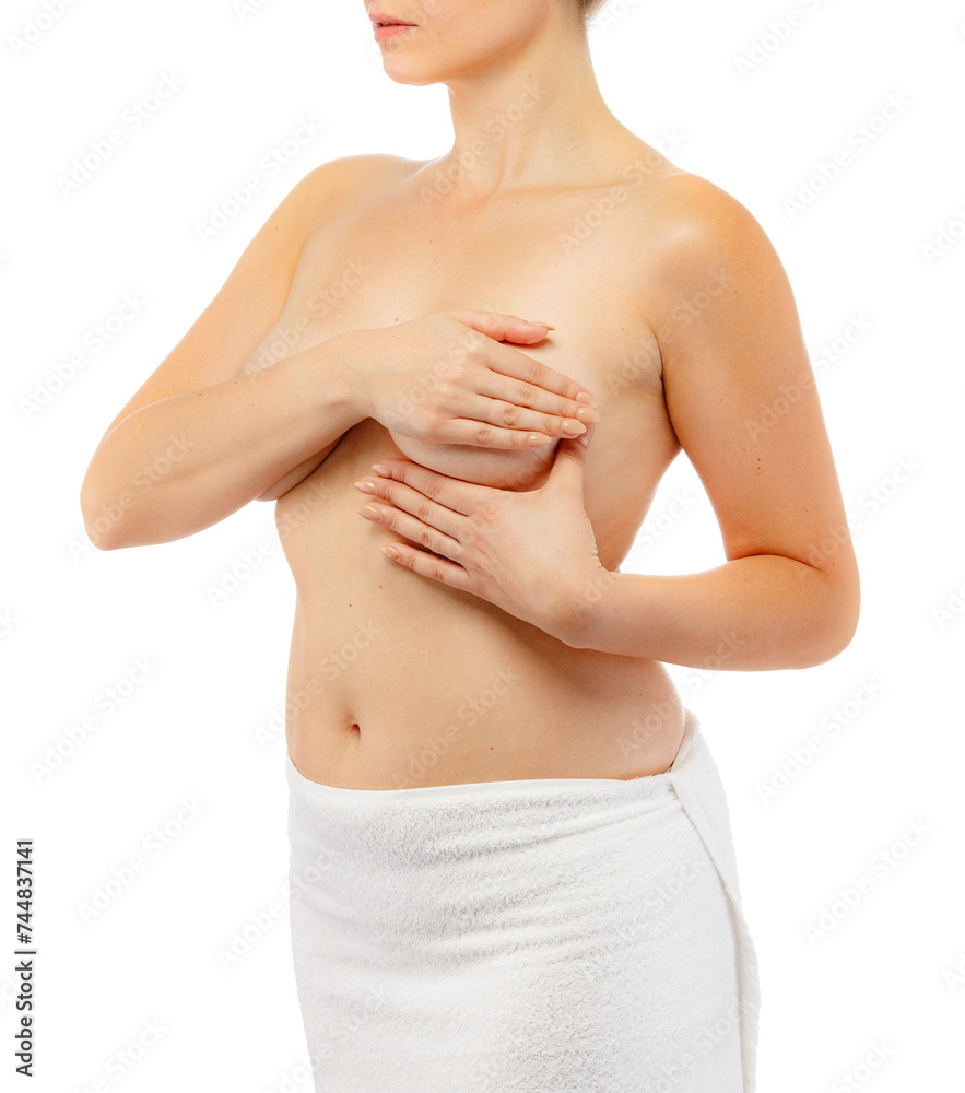 Woman examining her breast isolated on white background
Woman examining her breast isolated on white background
