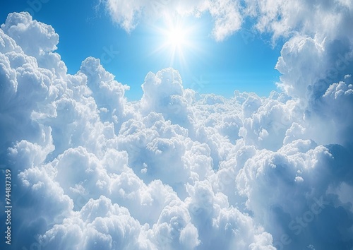 Sunlight Shining Through Fluffy Clouds in a Blue Sky © Ross