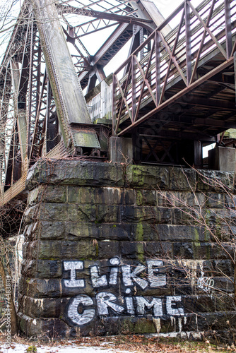 Old bridge abutment with I Like Crime graffiti 