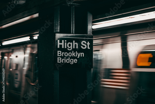A subway train passes thrugh the station in New York City photo