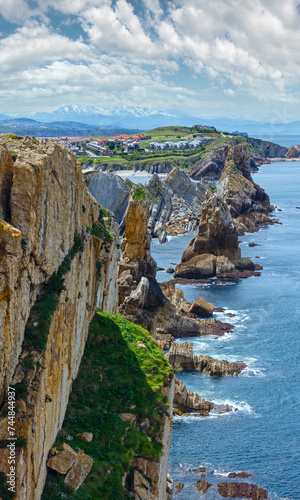 Atlantic ocean rocky coastline near Portio Beach, (Pielagos, Cantabria, Spain) photo