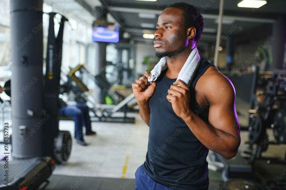 Young African-American man in a gym preparing to exercise
