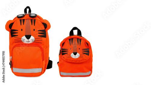 Front view closeup of colorful tiger-shaped schoolbags isolated on white copy-space background. (ID: 744857918)