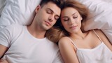 young loving couple sleeping together in bed