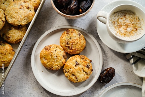 Homemade date scones served with cup of coffee and fresh date fruits