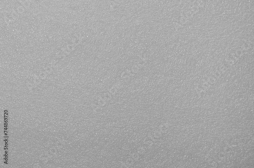 white sponge foam material surface background. springy and textured synthetic material. soft pores. sponge foam for cushioning photo