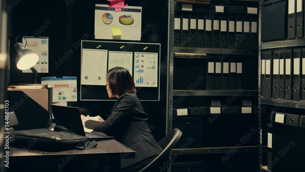 Law agent studying criminal case files and statements, working on uncovering new clues in archive room. Private investigator looking into suspects background checks, criminology. Camera B.