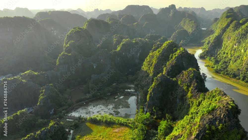 beautiful aerial view of sunset in Ninh Binh in Vietnam, UNESCO World Heritage Site in Vietnam, drone view of Tam Com
