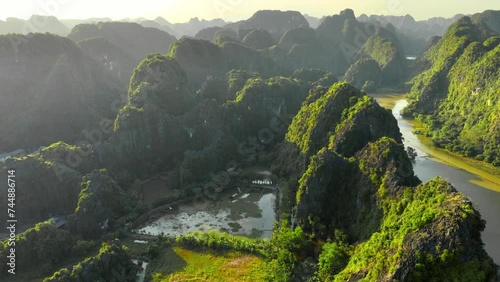 beautiful aerial view of sunset in Ninh Binh in Vietnam, UNESCO World Heritage Site in Vietnam, drone view of Tam Com