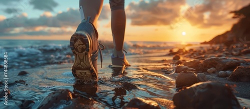 Personal growth journey, athlete with prosthetic leg on coastal trail, sunrise inspiration photo