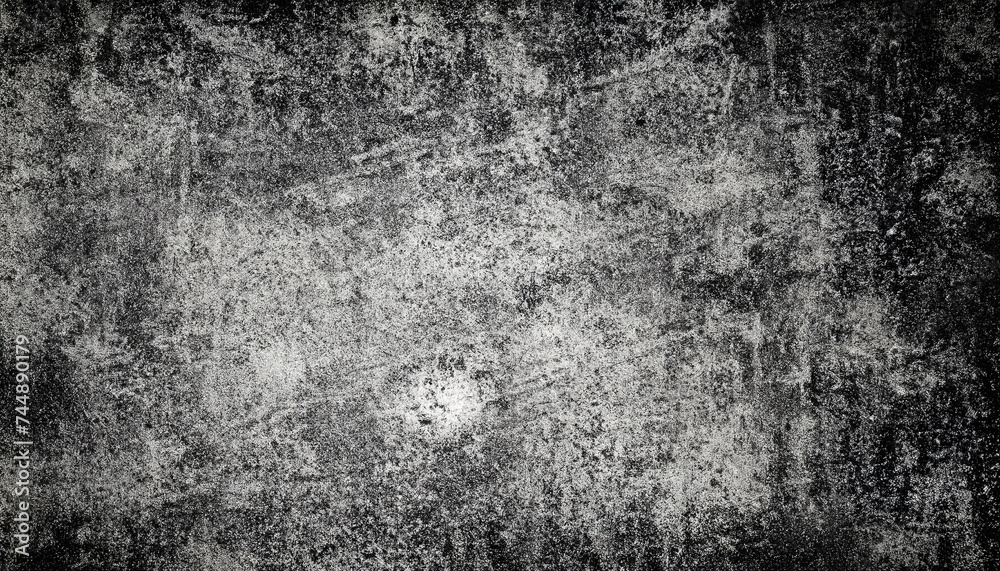 Fototapeta premium Old washed grunge mottled texture. High-contrast mottled and scratched background. Dirty backdrop with black scuffed edges and old faded antique design.