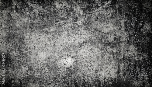 Old washed grunge mottled texture. High-contrast mottled and scratched background. Dirty backdrop with black scuffed edges and old faded antique design.