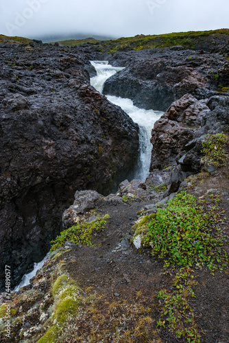 Qolortorsuaq waterfall near Sisimiut, Greenland on a misty day. photo