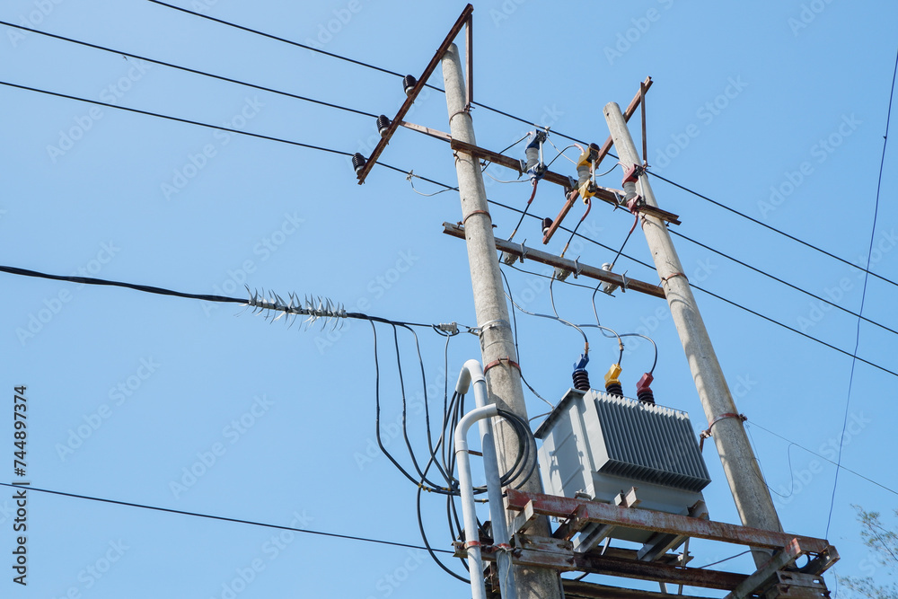 Electrical substation with bright blue sky background Electrical substation with bright blue sky background