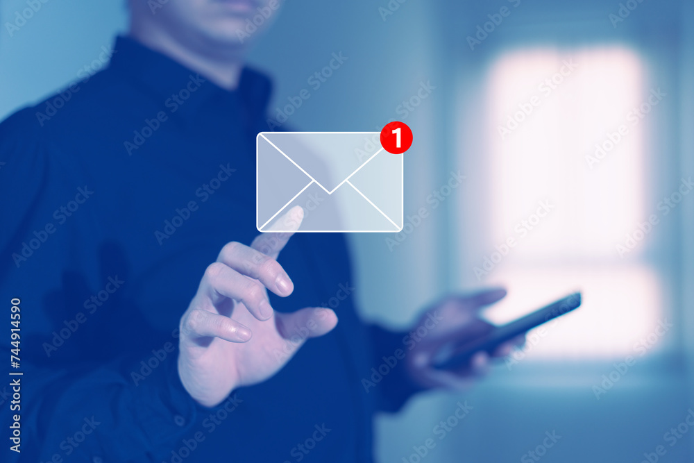 businessman press email screen for responding mail alert sign with blur holding smartphone