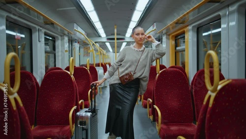 Beautiful passenger posing train leaning at handrail zoom in. Short hair model photo