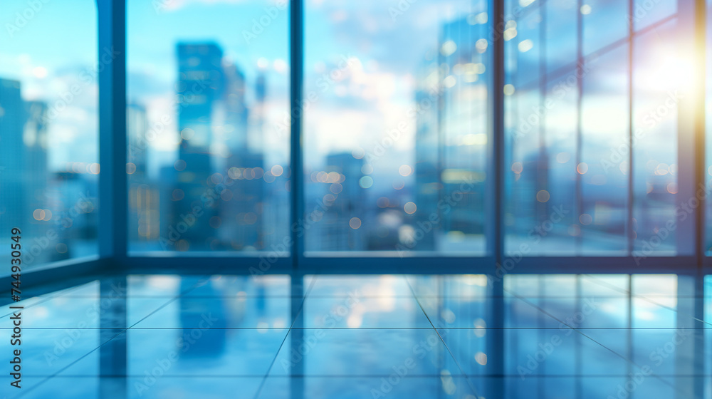 Blurred background of a light modern office interior with panoramic windows and beautiful lighting.