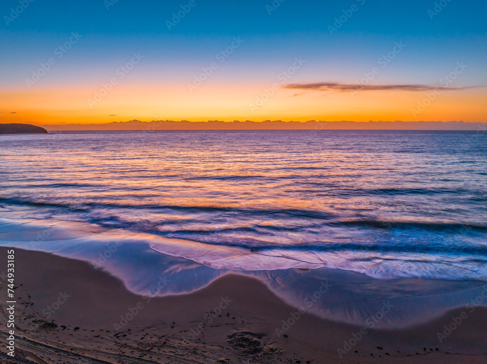 Fototapeta premium Sunrise at the seaside with orange horizon