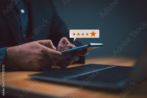 User give rating to service experience on online application, Customer review satisfaction feedback survey concept, Customer can evaluate quality of service leading to reputation ranking of business. photo