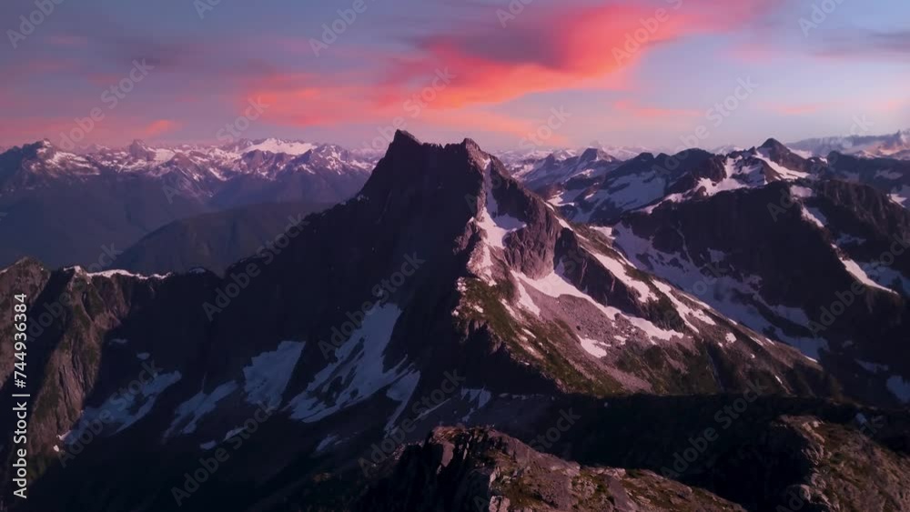Dramatic Rocky Peak and Mountain Landscape, Snow. Colorful Sunset Sky. Late Winter, Early Spring. Aerial Cinematic. Chilliwack, BC Canada. Dramatic Rocky Peak and Mountain Landscape, Snow. Colorful Sunset Sky. Late Winter, Early Spring. Aerial Cinematic. Chilliwack, BC Canada.