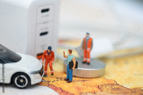 Miniature Figures and Electric Car Charging Station.