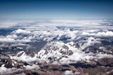 Aerial top view of brown snow covered Himalayan range from an air plane in Ladakh