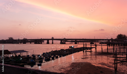 Amazing colorful sky above Sarasin bridge..beautiful sky during sunset going down to the sea above fish cage beside Sarasin bridge..the bridge connect Phuket island to Phang Nga province