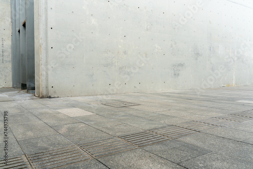 empty concrete floor in front of modern buildings in the downtown street. copy space for parking lot. photo