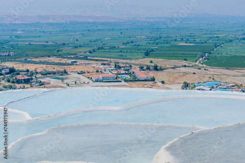 Panoramic view of Pamukkale terraces overlooking a rural landscape, in Turkiye