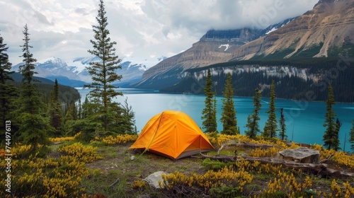People Camping against a lake and mountain