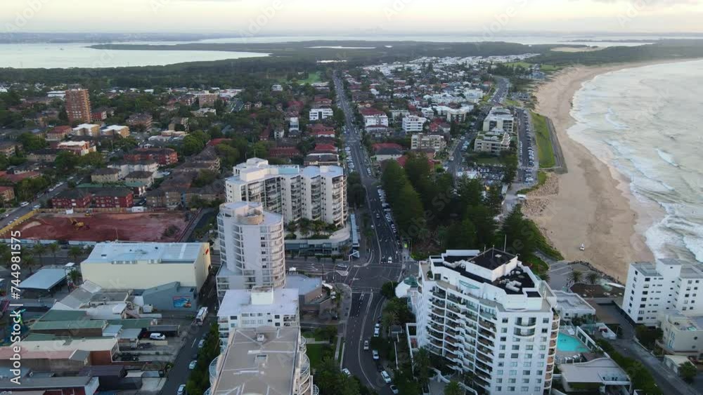 Aerial drone view of Cronulla in the Sutherland Shire, South Sydney, NSW Australia looking down Elouera Road during an early morning sunrise in February 2024   