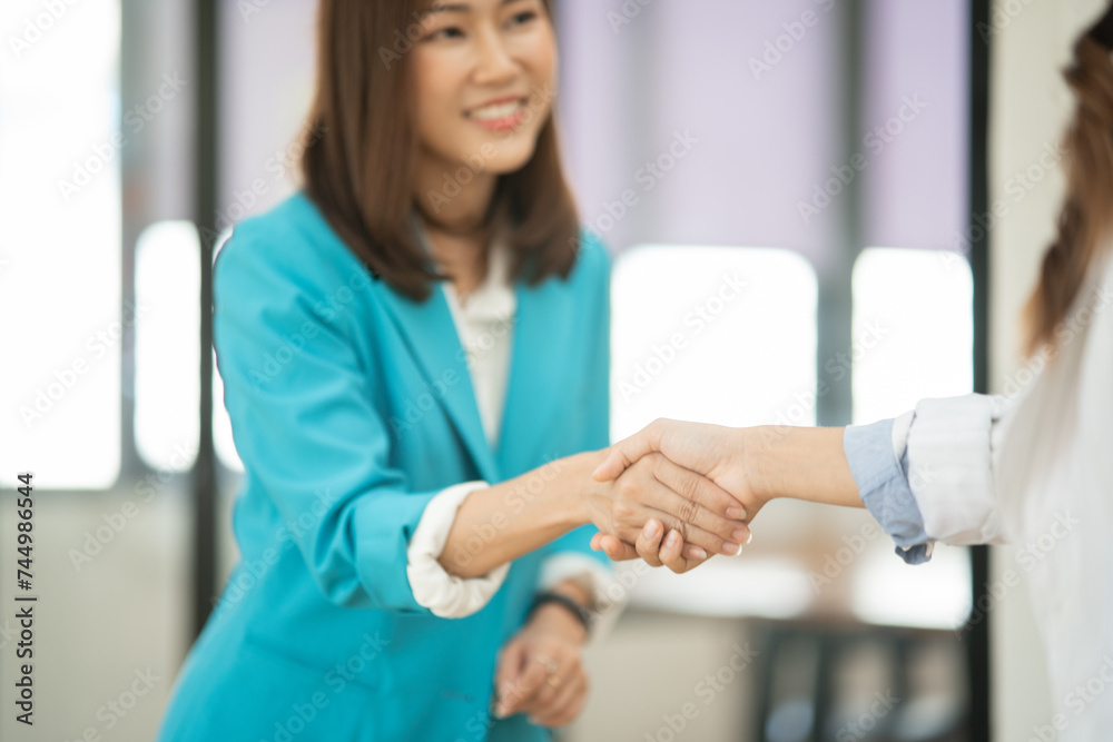 Asian business woman working and talking at the office
Asian business woman working and talking at the office
