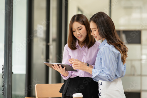Asian business woman working and talking at the office
