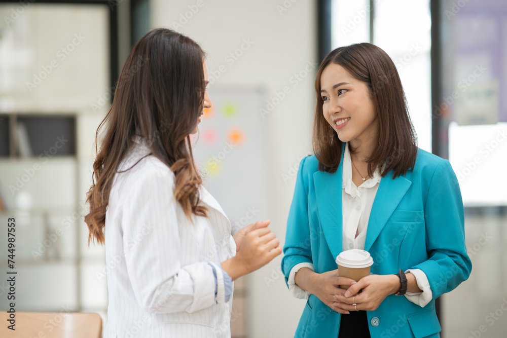 Asian business woman working and talking at the office
Asian business woman working and talking at the office