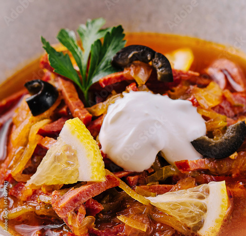 meat and salt soup Solyanka in bowl photo