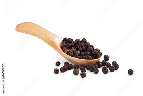 Wooden spoon with black pepper and peppercorns isolated on a white background. Spices for cooking
